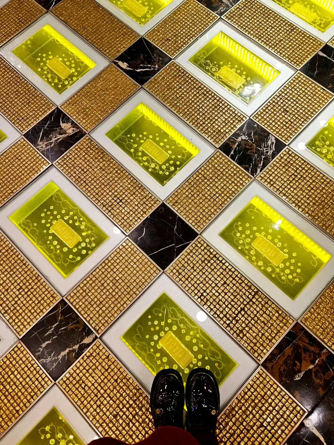 Stacked gold bars in a secure bank vault.