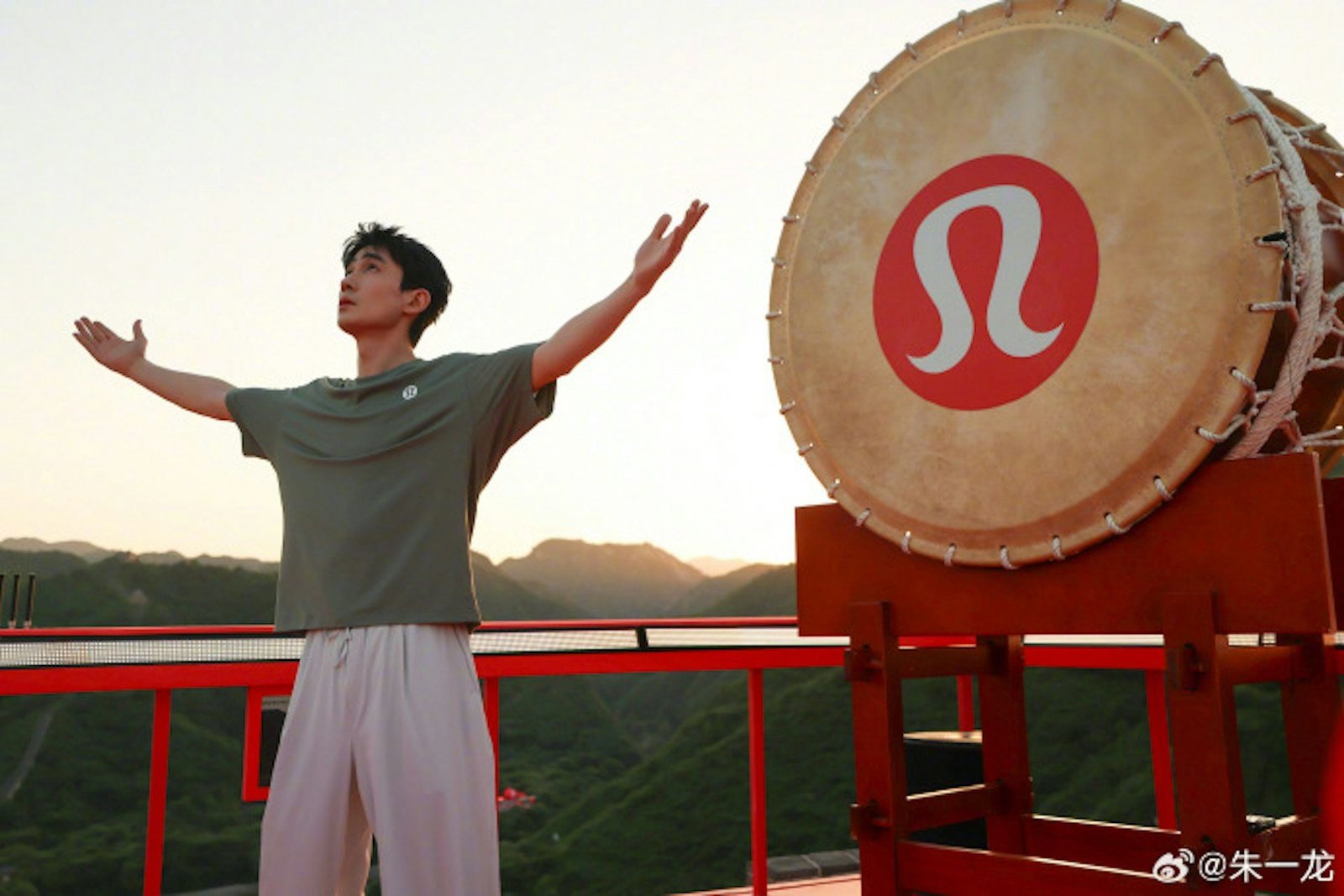 Article content Celebrity beating a Japanese taiko drum on a Great Wall beacon tower during Lululemon's May 2026 campaign
