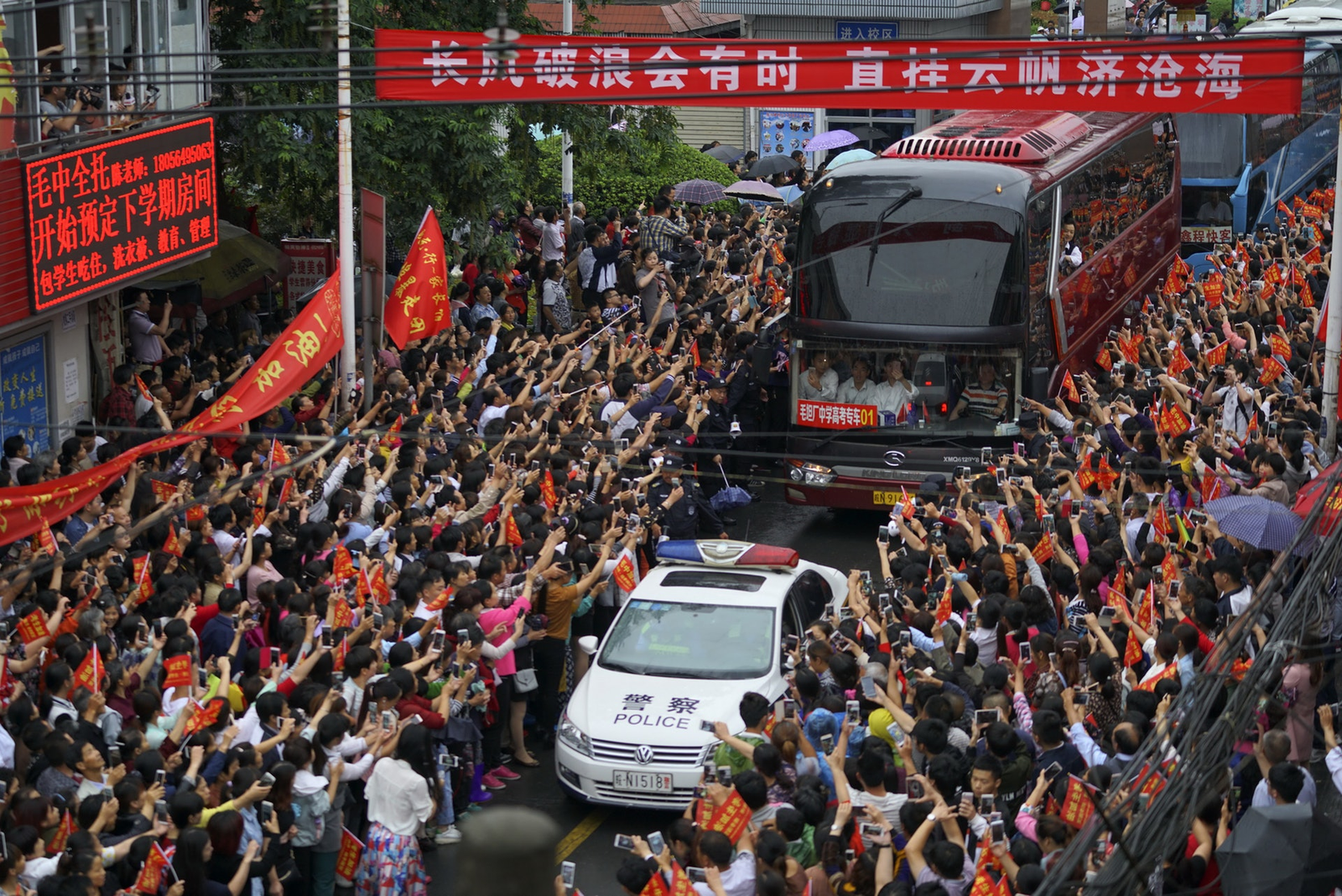 Thousands of students gathering at a Chinese high school for Gaokao send-off, representing the massive mathematical screening funnel fueling the AI talent pipeline.