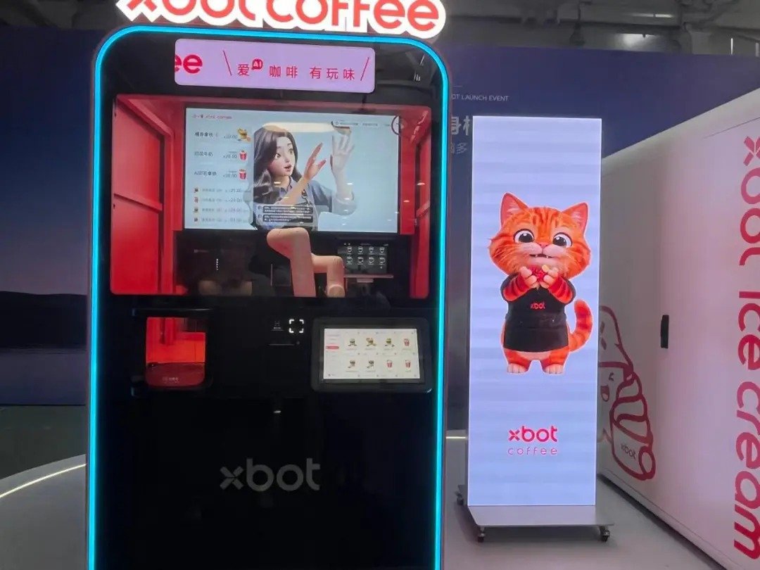 Robotic arm gripping a coffee cup behind a protective glass cover
