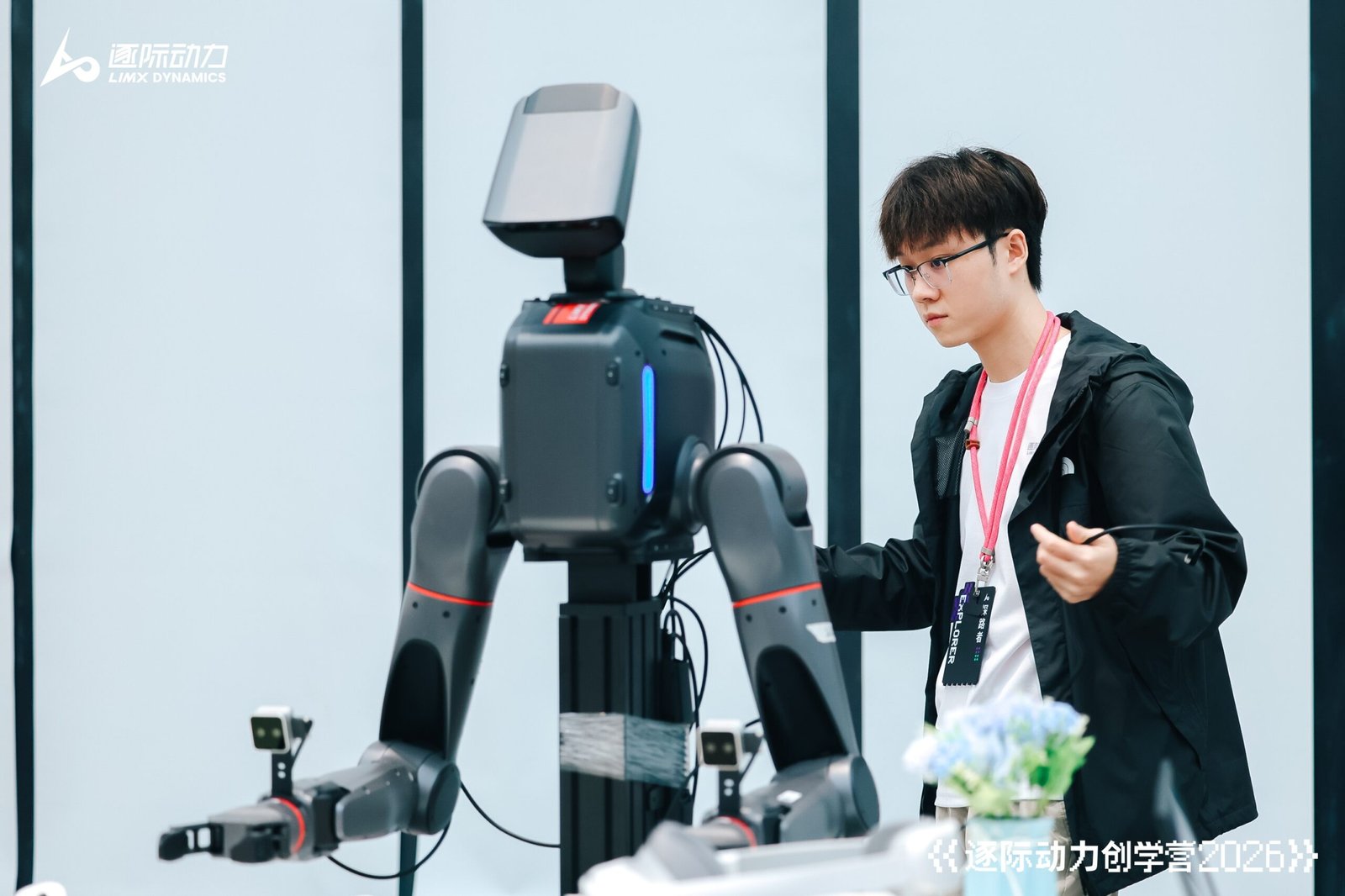 Students deploying and debugging code on a LimX Dynamics humanoid robot at the Shenzhen camp