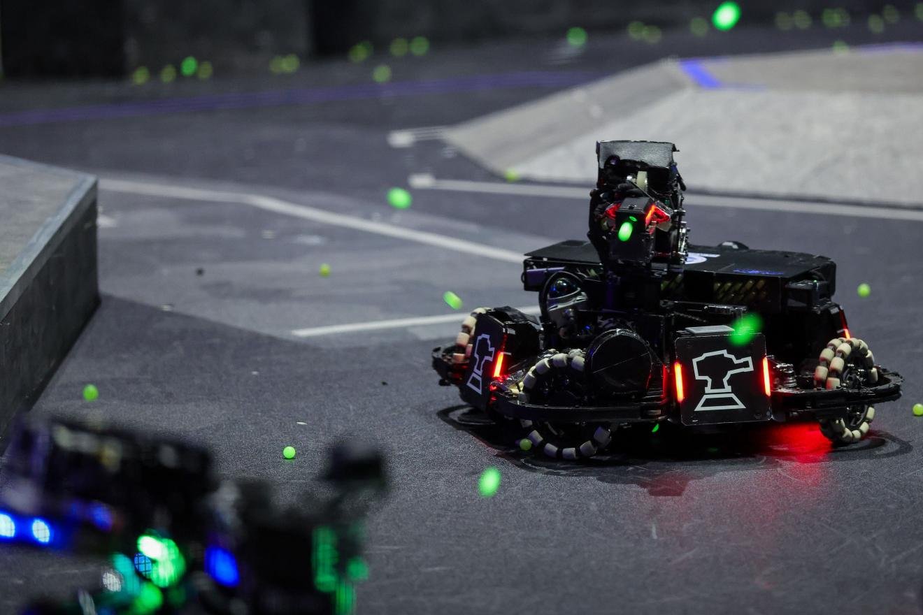 Sentry and engineering robots operating during a RoboMaster 2026 match in Shenzhen