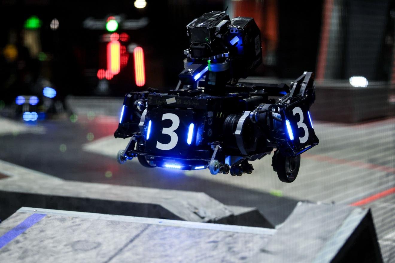 Aerial robot flying above the RoboMaster 2026 arena in Shenzhen
