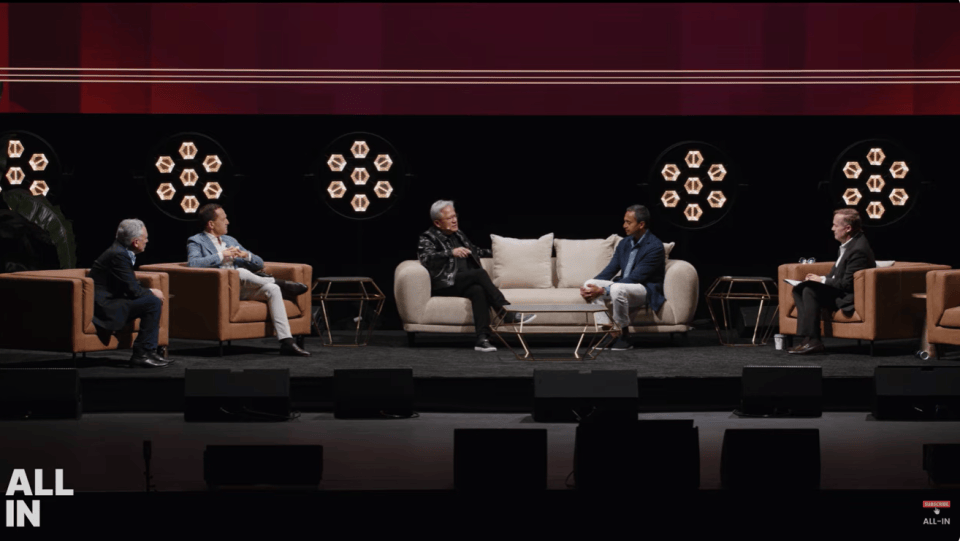 Jensen Huang speaking on stage at a technology conference