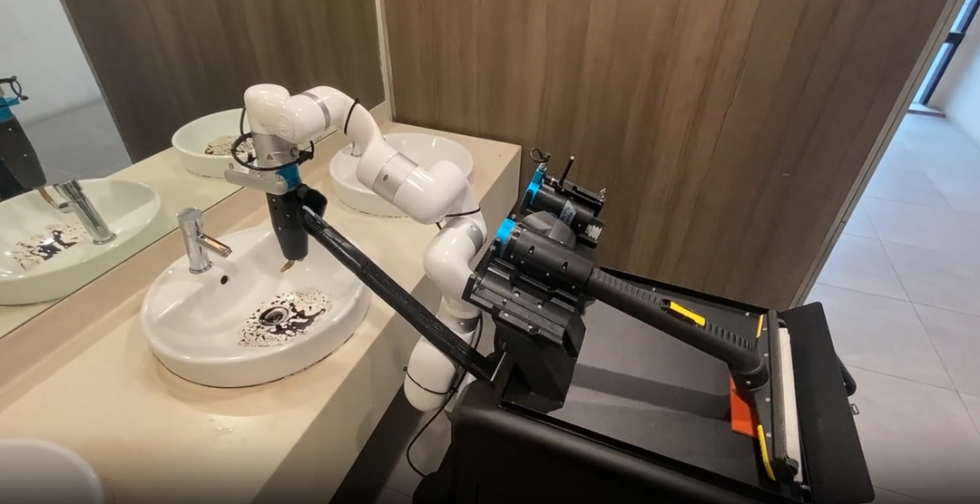 Abluo robot operating inside a commercial restroom