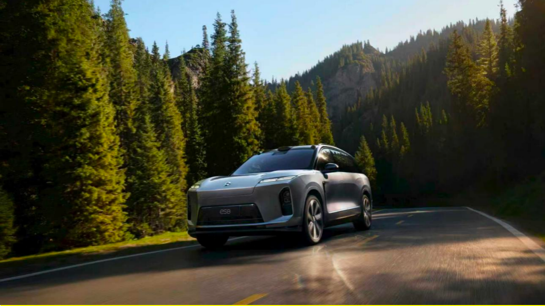 NIO executive on stage at a launch event