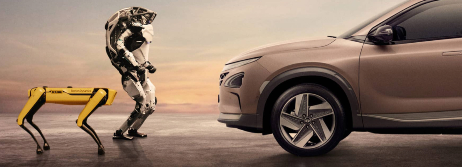 Boston Dynamics Atlas humanoid and quadruped robot displayed beside a Hyundai vehicle