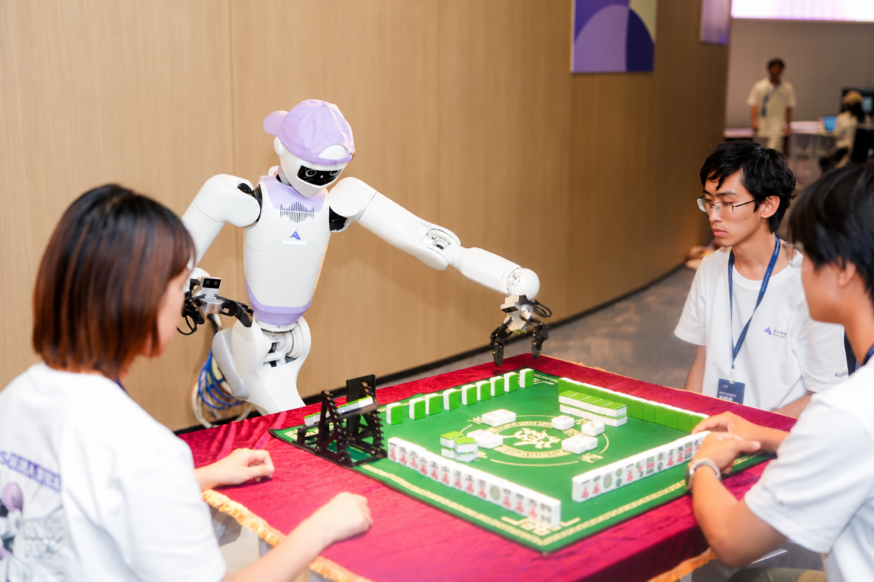 A humanoid robot playing mahjong with developers at the Astribot robot app hackathon in Shenzhen