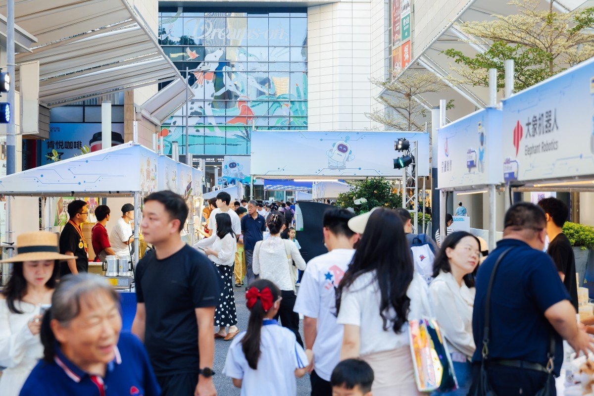 Robot dog demonstration in front of shoppers at a Shenzhen mall event