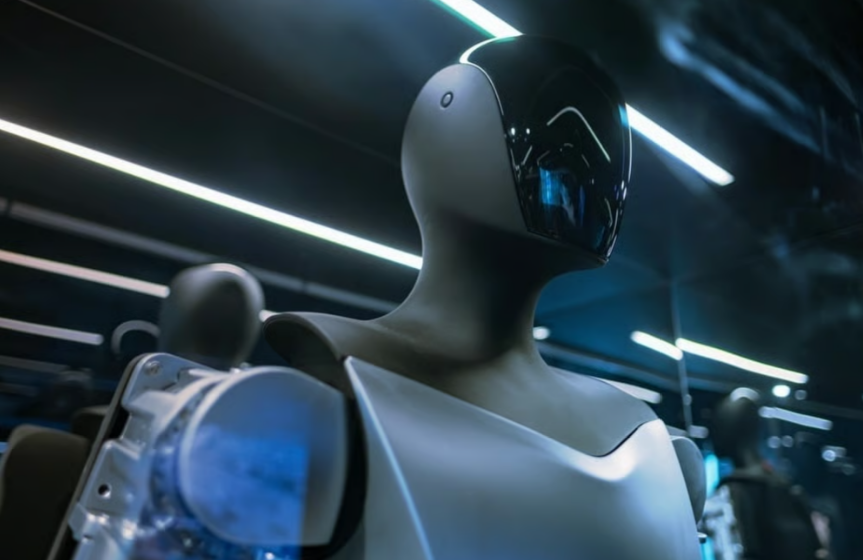 Tesla Optimus humanoid robot standing in a demonstration setting