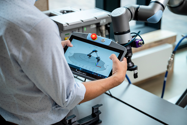 Humanoid robot performing a logistics handling task in a warehouse