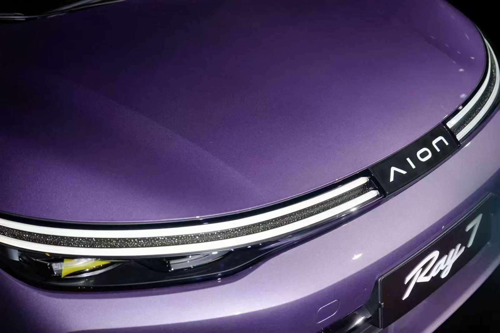 Aion Ray7 fastback sedan showing the 3.25-metre dual-ring front light strip
